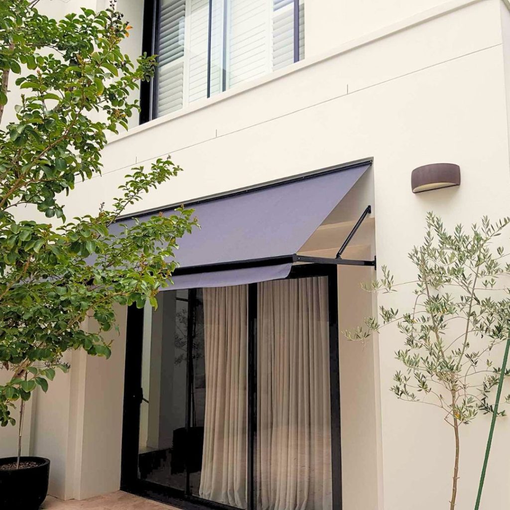 Fixed Pivot Arm Awning by Outdoor Blinds and Awnings (OBA)