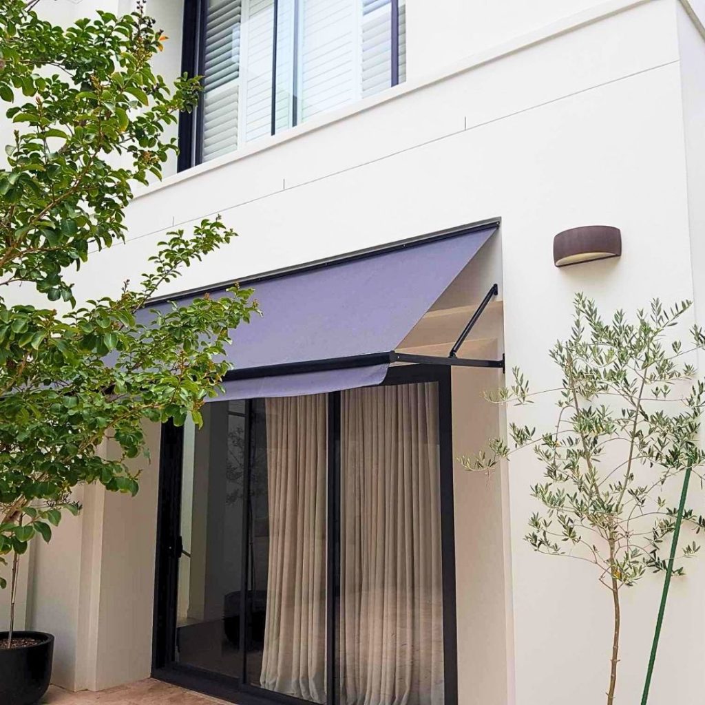 Fixed Pivot Arm Awning by Outdoor Blinds and Awnings (OBA)