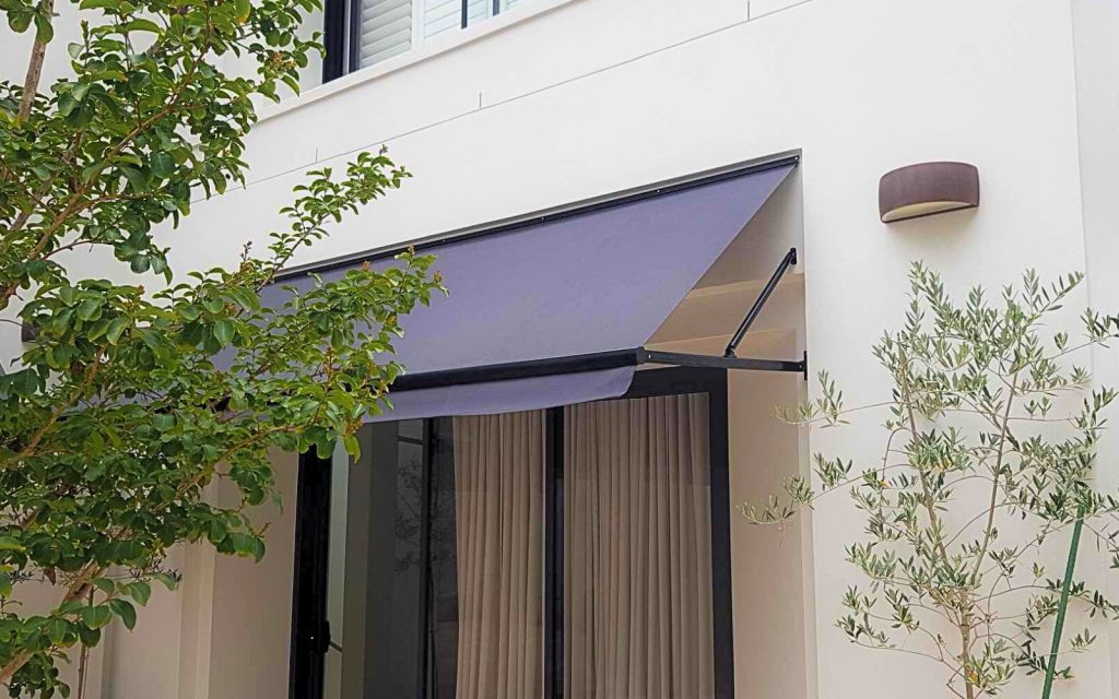 Fixed Pivot Arm Awning by Outdoor Blinds and Awnings (OBA) Header Image