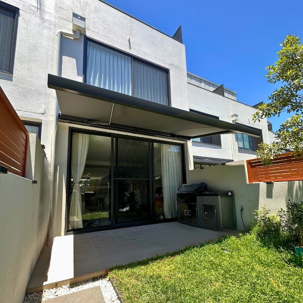 Cubebox Folding Arm Awning by Outdoor Blinds and Awnings (OBA)