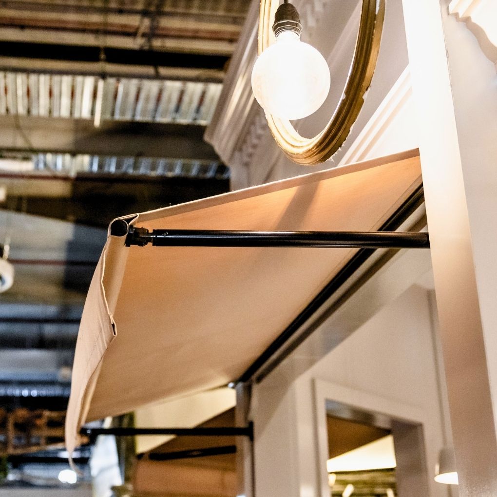 Fixed Pivot Arm Awning by Outdoor Blinds and Awnings (OBA)