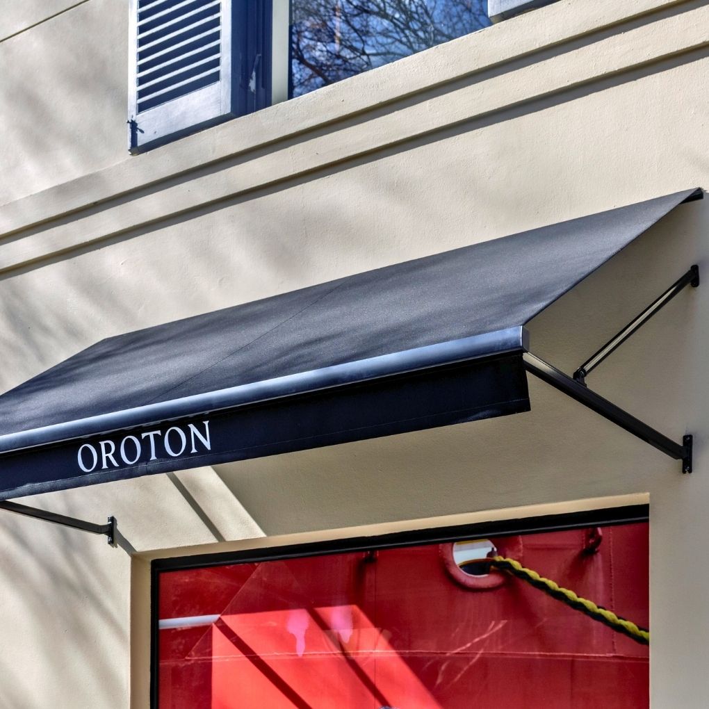 Fixed Pivot Arm Awning by Outdoor Blinds and Awnings (OBA)