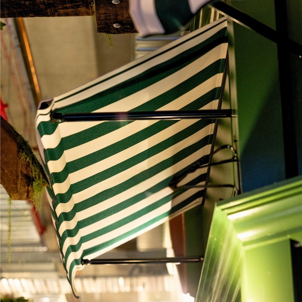 Fixed Pivot Arm Awning by Outdoor Blinds and Awnings (OBA)