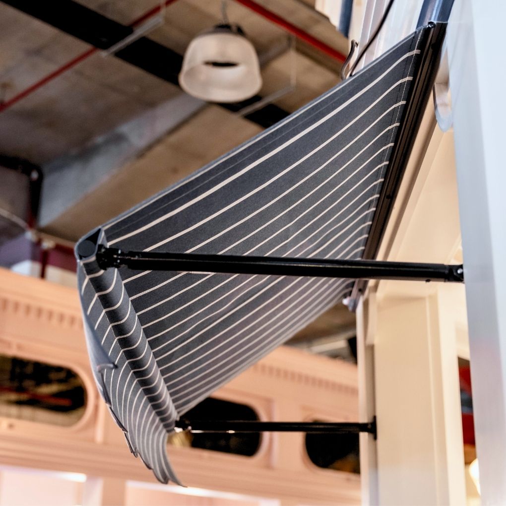Fixed Pivot Arm Awning by Outdoor Blinds and Awnings (OBA)