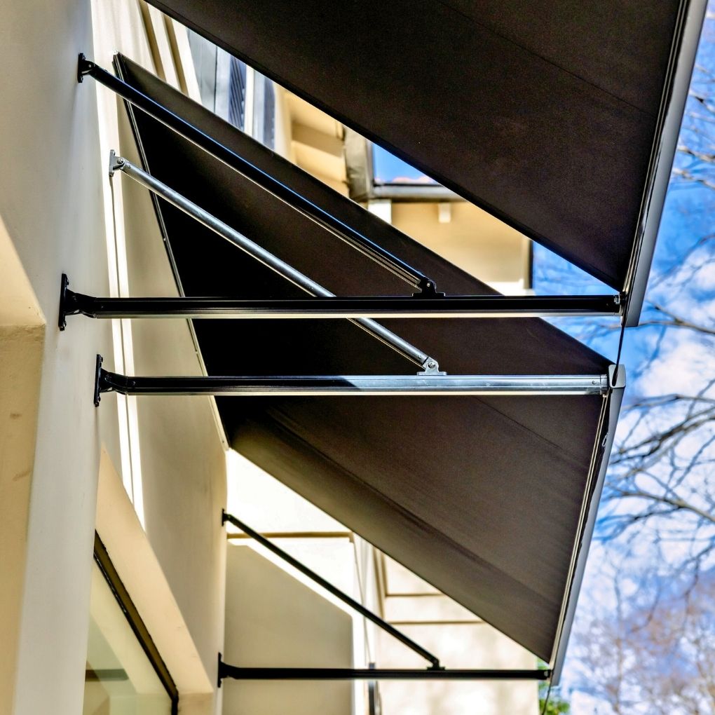 Fixed Pivot Arm Awning by Outdoor Blinds and Awnings (OBA)