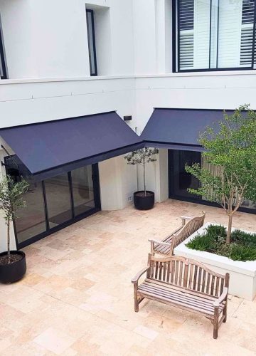 Fixed Pivot Arm Awning by Outdoor Blinds and Awnings (OBA)