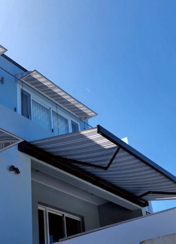 Cubebox Folding Arm Awning by Outdoor Blinds and Awnings (OBA) and Wedge Canopy Awning